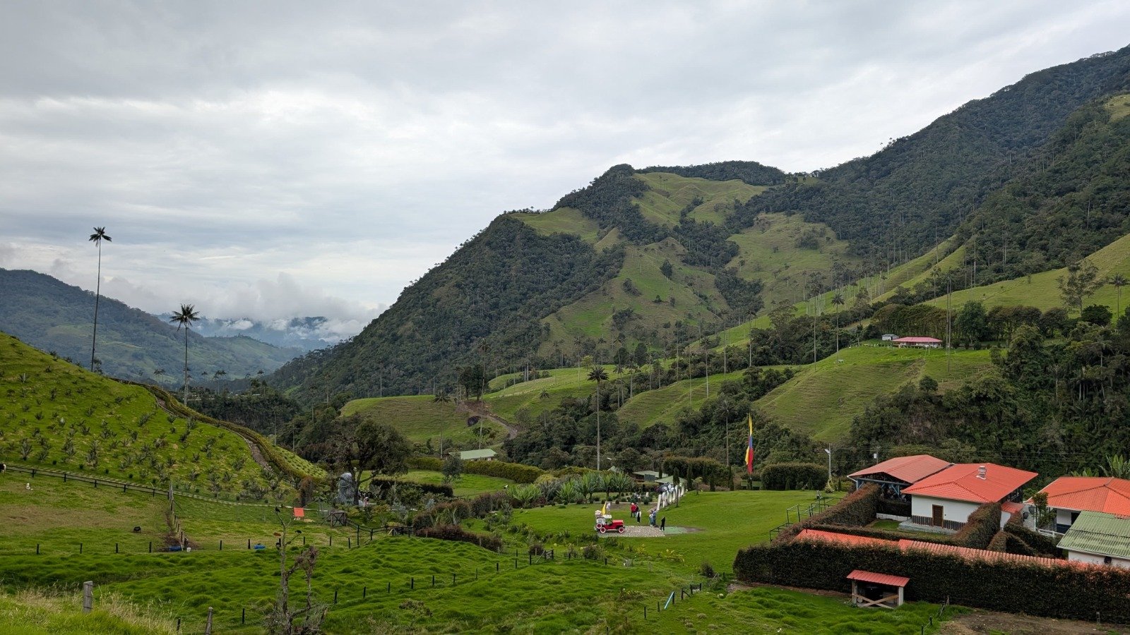 Why visit Colombia — sweeping green valleys and traditional red-roofed farmhouses in the Colombian coffee heartland, Eje Cafetero